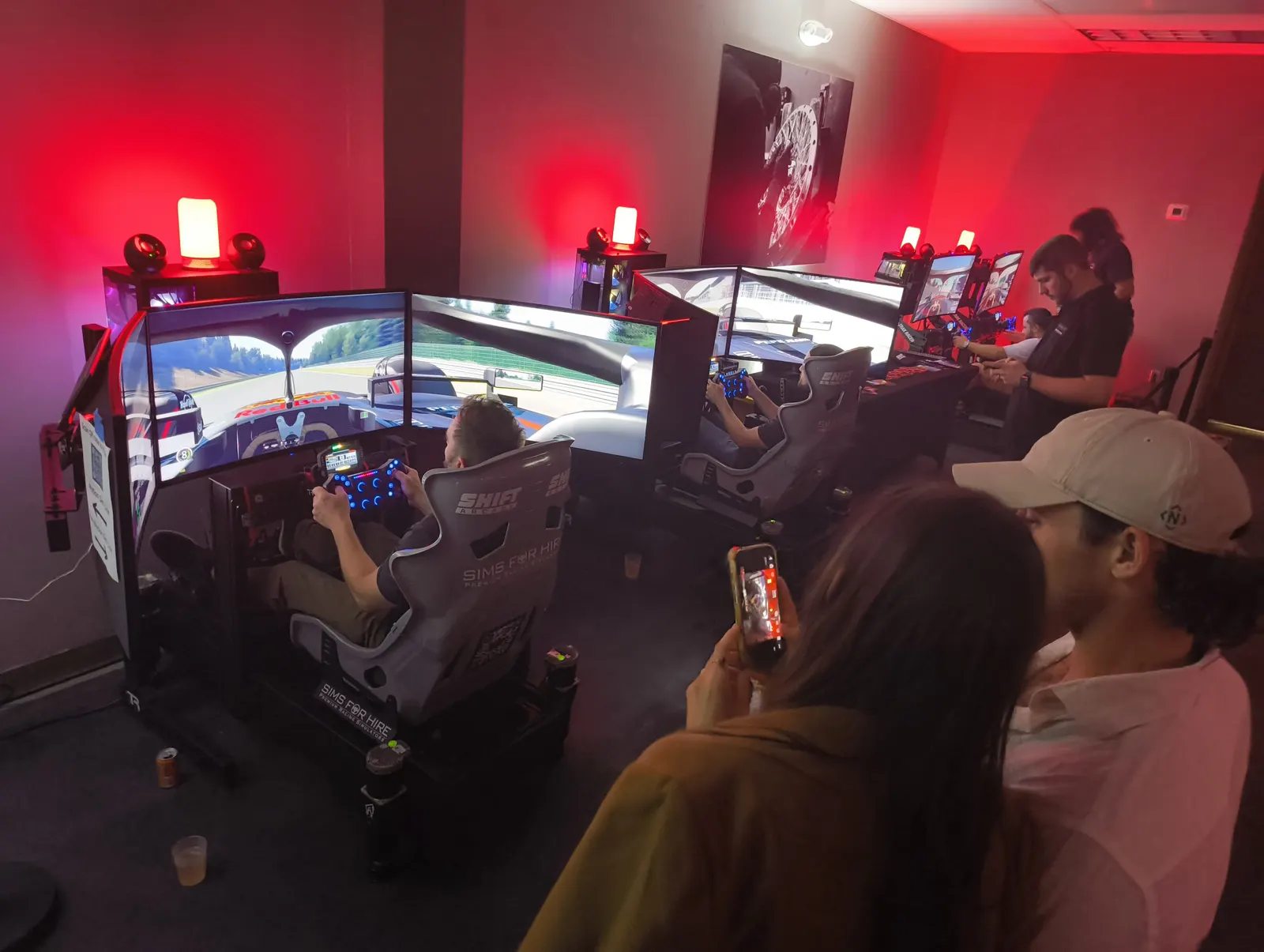 Guests racing on SimsForHire simulators at an Art Basel Miami event