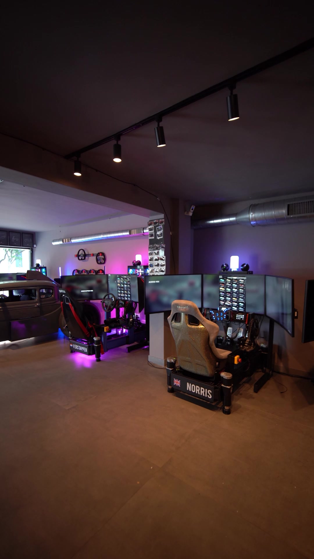 Full-motion racing simulators at a SimsForHire event in Miami