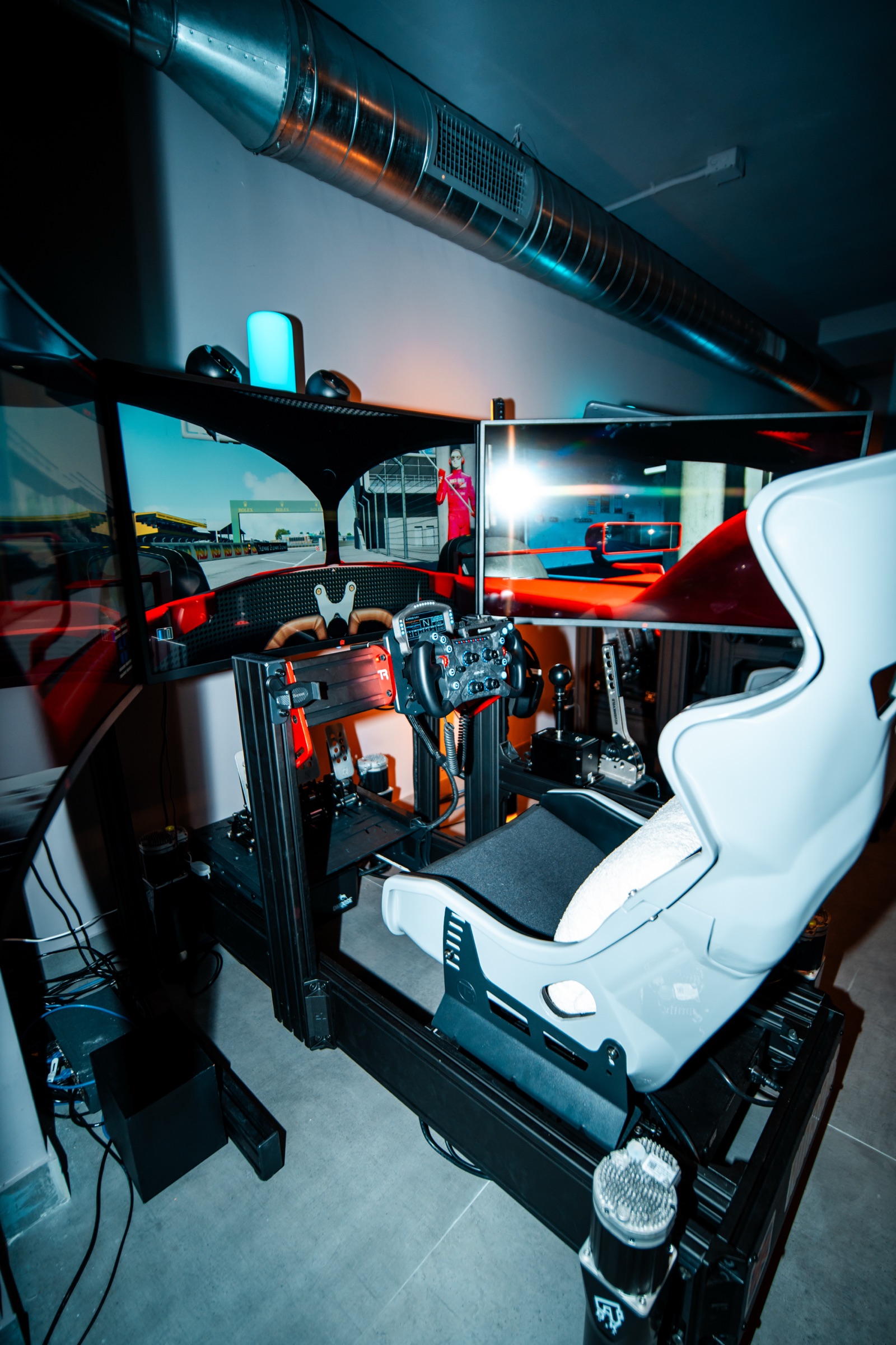 Full-motion racing simulator rig with triple screens in Moore Haven