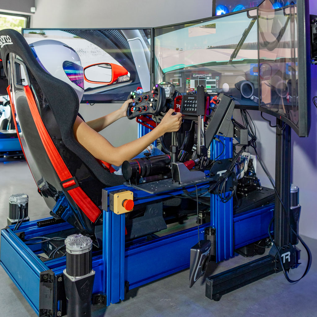 Full-motion racing simulator rig with triple screens in Stuart