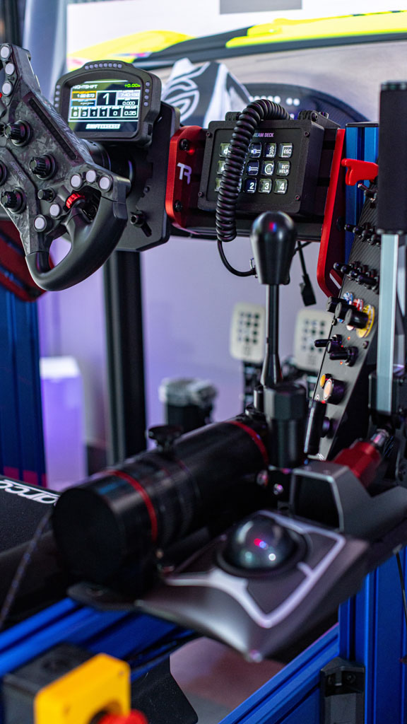 Full-motion racing simulator rig with triple screens in Okeechobee