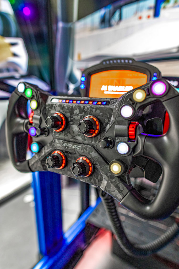 Full-motion racing simulator rig with triple screens in Cutler Bay