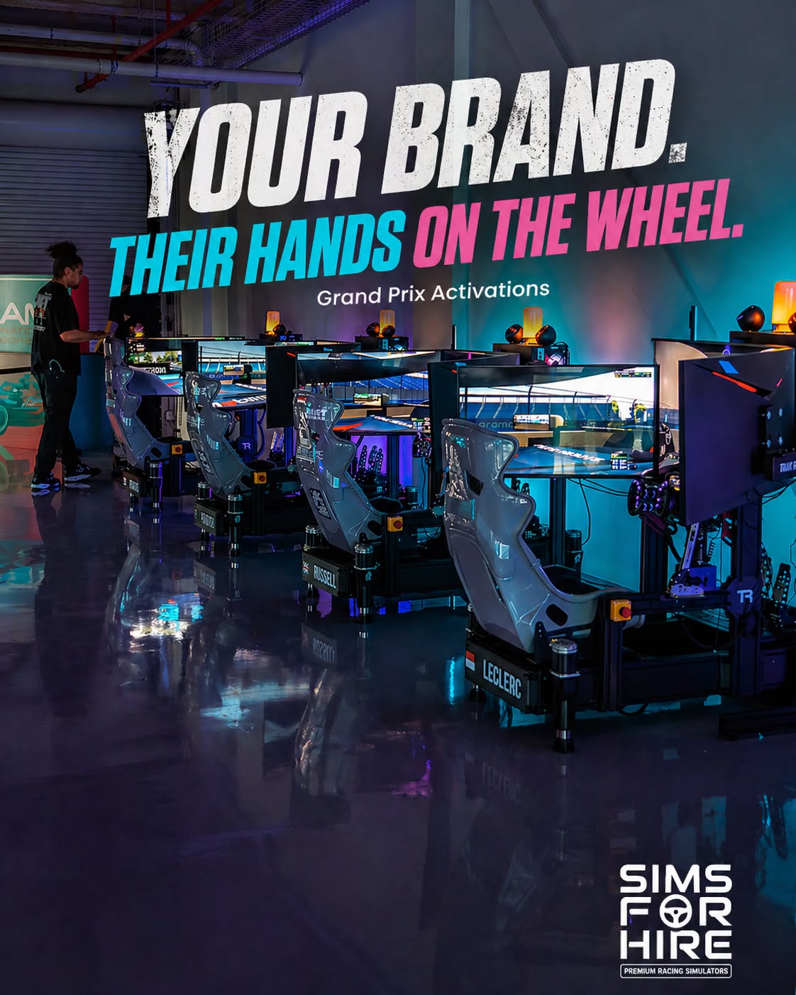 Branded racing-simulator activation — a row of full-motion rigs set up for a Grand Prix event